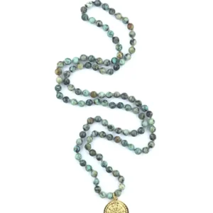 Green beads chain with golden medallion