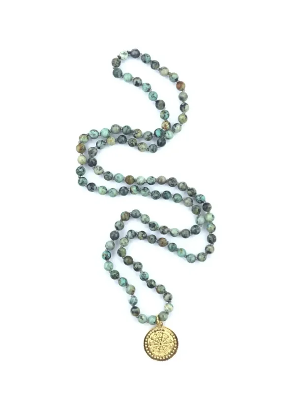 Green beads chain with golden medallion