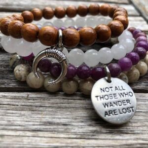 Lepidolite, Baying Wood Bead, Semi-Precious African Opal and Snow Quartz. “Not all that wander are lost” and Crescent Moon charms.