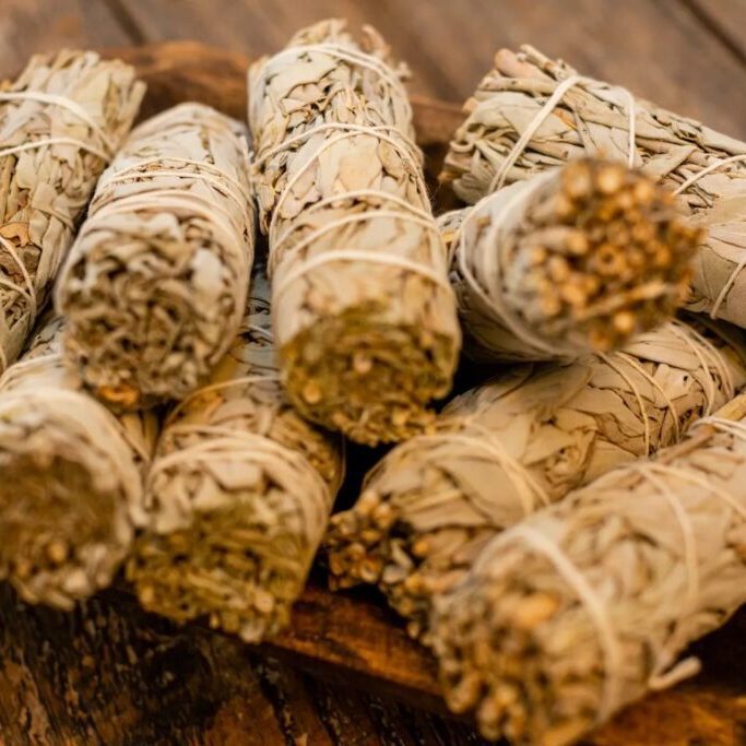 Tray with stacks of white sage sticks