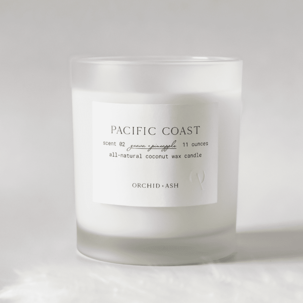 White, coconut wax blend candle with frosted glass.